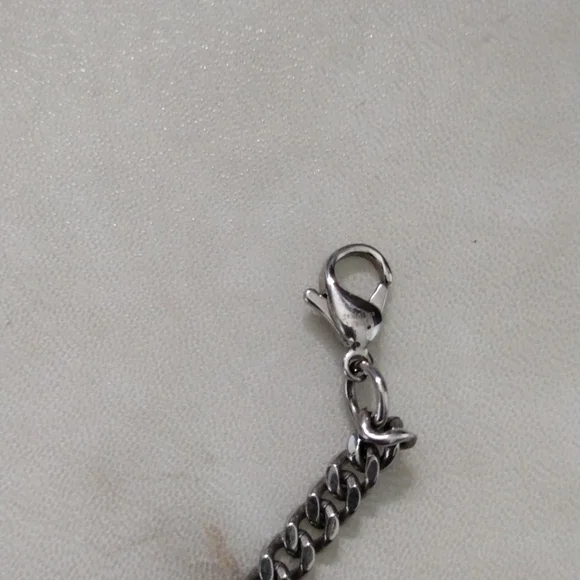Chisel stainless steel skull pendant and chain necklace.